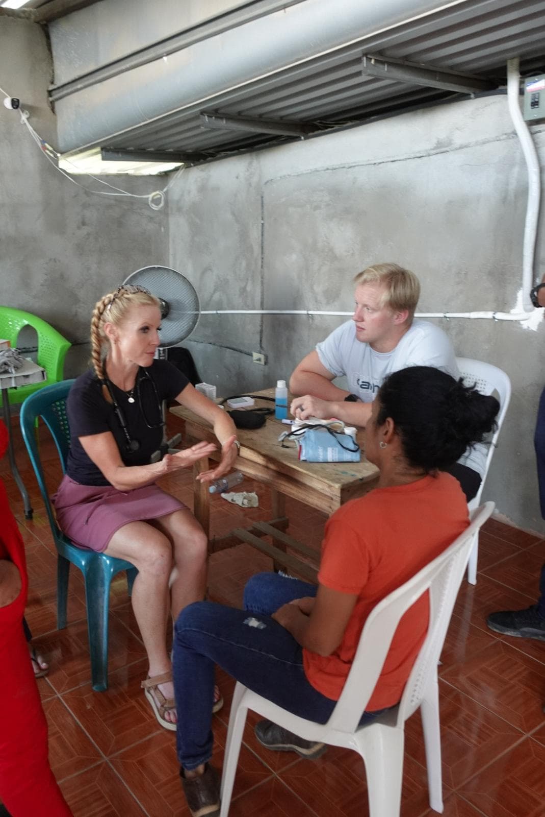 Medical volunteers attending to a patient at the community clinic